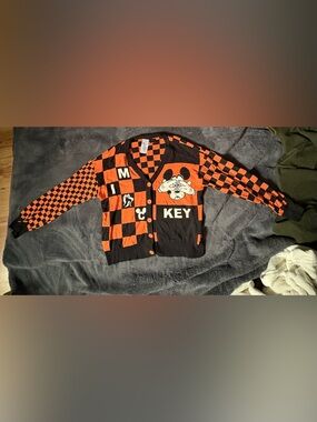From Disney park limited edition Orange and Black Mickey Cardigan Sweater